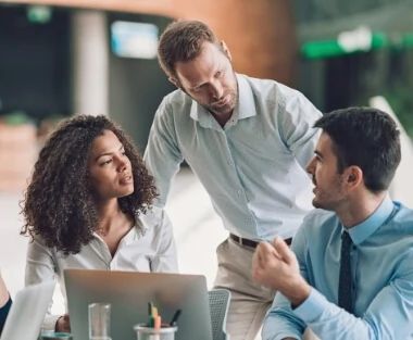 Three people discussing